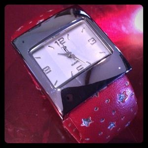 P silver tone rect. face red star dec band watch.
